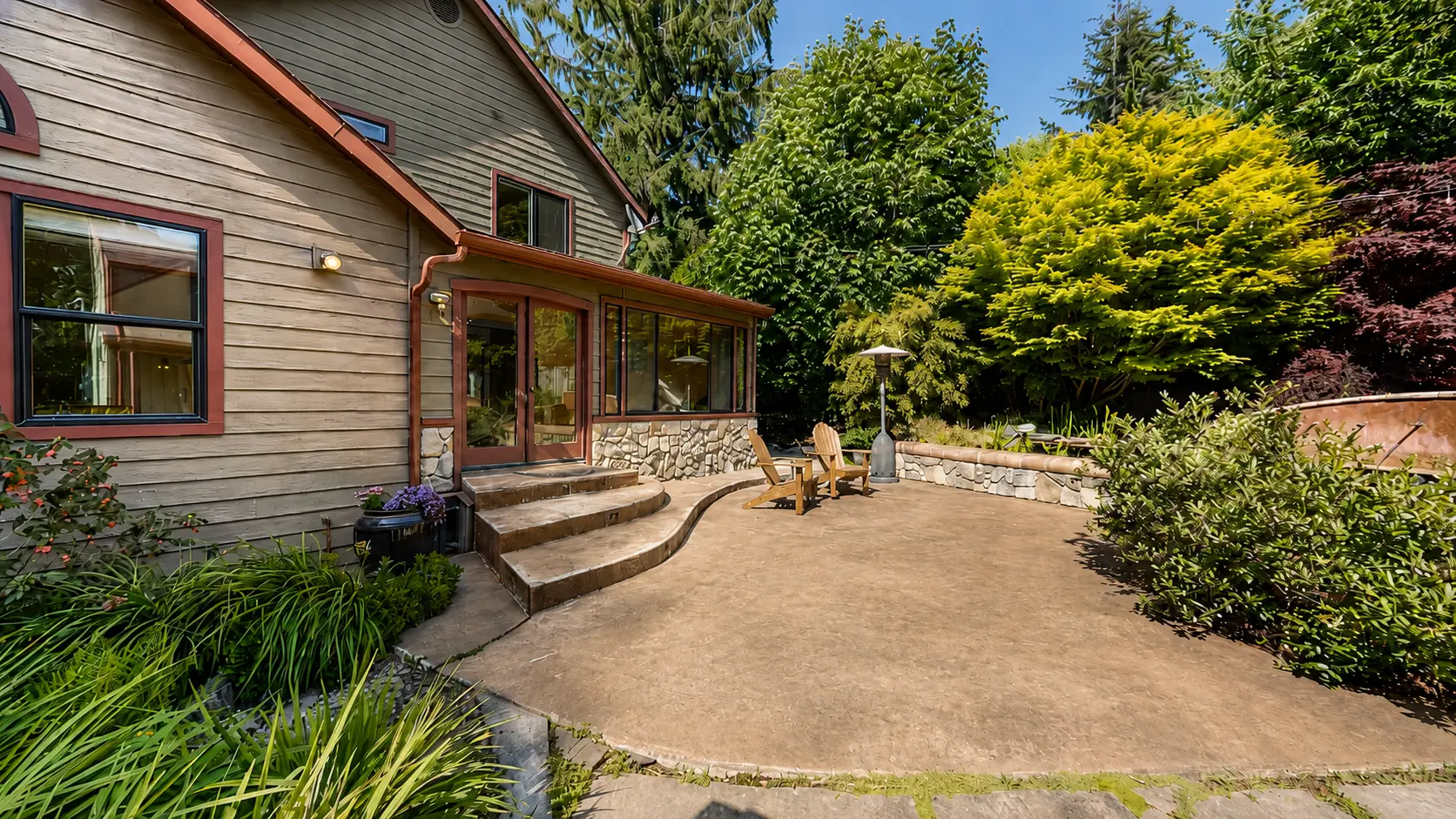 Mature landscaped courtyard with stone hardscape and planting